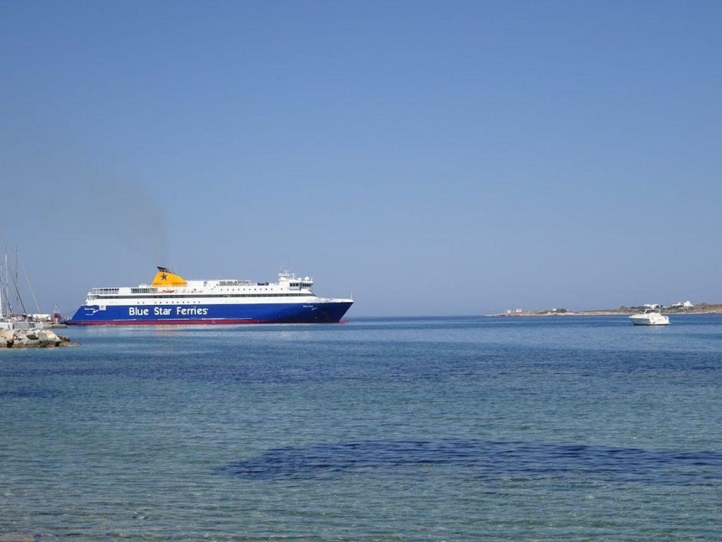 A Blue Star Ferry docked in Paros Port on a clear day