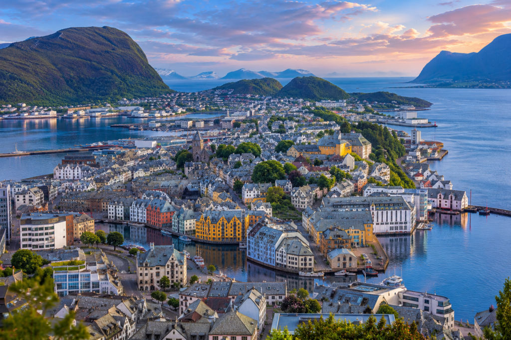 Hidden Gems in Europe - Ålesund, Norway colorful Art Nouveau coastal town surrounded by fjords, mountains, peaceful harbor waters, and dramatic Nordic scenery beneath soft evening light.