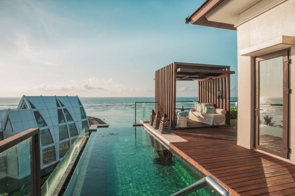 Private infinity pool villa overlooking the ocean at The Ritz-Carlton Bali in Nusa Dua with luxury outdoor daybed and panoramic sea views.