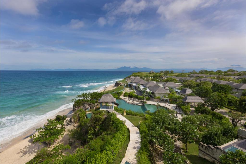 Best Honeymoon Resorts in Uluwatu, Bali - Jumeirah Bali beachfront resort featuring luxury villas, tropical gardens, and sweeping ocean views, ideal for a romantic honeymoon in Bali.