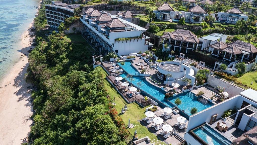 Best Honeymoon Resorts in Nusa Dua - Samabe Bali Suites & Villas in Nusa Dua, Bali, showcasing luxury beachfront villas, infinity pools, tropical gardens, and stunning Indian Ocean views