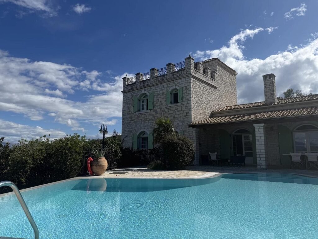 Villa Emily near Agios Stefanos Sinies, Corfu, featuring a private swimming pool and distinctive castle-inspired stone architecture